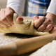Hands kneading pizza dough